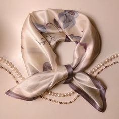 Discover timeless elegance with our exquisite silk scarf from Silquora. Handmade from high-quality silk, this scarf combines luxury and style at the highest level. A must-have accessory for every occasion. Our Silquora silk scarf is more than just an accessory - it's a statement of sophistication and taste. Each scarf is carefully handcrafted from the finest silk, creating a luxurious texture and silky sheen. From elegant evening events to casual outings on the town, this scarf will add unparall Cream Silk Scarf For Formal Occasions, Elegant Silk Scarves With Satin Finish, Classic Silk Scarf For Weddings, Classic Silk Scarf For Wedding, Elegant Spring Silk Scarf With Satin Finish, Elegant Square Scarves For Gifts, Elegant Square Scarf For Gift, White Satin Silk Scarf Chic Style, Elegant Square Scarf Gift