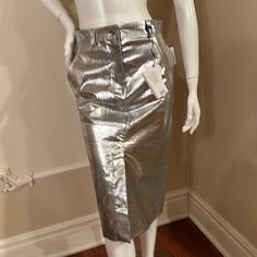 Waist 28 Inches Hips 36 Inches Length 27 Inches The Fabric Does-Not Stretch Add A Touch Of Metallic Glam To Your Wardrobe With This Cedric Charlier Skirt. The Knee-Length, Straight And Pencil Style Skirt Features A Multicolor Pattern With Silver Accents, Perfect For Parties Or Cocktail Events. The Skirt Is Made Of 100% Cotton Fabric And Has A High-Rise Waist With A Zip Closure. This Skirt Is A Regular Size 38, Made In Italy And Has A Retail Value Of $990. The Fabric Wash Is Light And The Garment Chic Metallic Lined Skirt Bottoms, Chic Metallic Bottoms With Lined Skirt, Luxury Bottoms For Night Out In Spring, Luxury Spring Bottoms For Night Out, Chic Metallic Skirt For Spring, Luxury Spring Skirt, Luxury Party Pencil Skirt, Modern Pencil Skirt For Spring Party, Luxury Lined Skirt For Spring