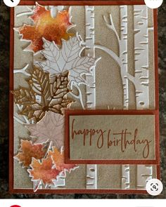 an autumn card with leaves and the words happy birthday