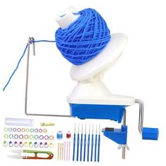 a blue ball of yarn sitting on top of a white table next to scissors and knitting needles