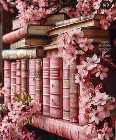 pink books are lined up on a book shelf with flowers growing out of the top