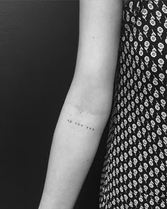 a woman with a small tattoo on her arm