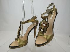 GORGEOUS  METALLIC  BRONZE LEATHER T-STRAP SANDALS PUMPS BY ROBERTO CAVALLI 100% AUTHENTIC GUARANTEED MADE IN ITALY Model T90057 RETAIL PRICE $ 1045, PRINTED ON THE BOX  EUROPE SIZE 37.5 - PRINTED ON THE SHOES ( Can be  converted to US Size  7 ) HEELS: 4 3/4" PLATFORM: 1/2" Nappa Leather upper T-Strap buckle closure Gold tone metal rings at front  COLOR:9229   These sandals are absolutely amazing.  The design is just incredible. More Cavalli insignia inside.  Original Roberto Cavalli box is incl Aesthetic Shoes, T Strap Sandals, T Strap, Roberto Cavalli, Nappa Leather, Metal Rings, Gold Tone Metal, Strap Sandals, Sling Backs