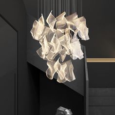 a modern chandelier hanging from the ceiling