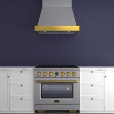 an oven and range in a kitchen with blue walls, white cabinets and gold trim