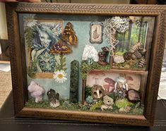 a shadow box with many different items in it