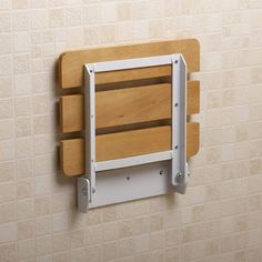 a wooden shelf mounted to the side of a wall