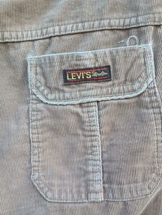 "Vintage mid-wale corduroy pants by Levi's.  Soft camel tan.  Poly/dacron zipper, button closure.  Front slant pockets. Small hole right front below pocket. Back patch pockets, featuring the hard to find golden gate label. No size tag.  Hem has likely been shortened, inseam measures 29\". 1\" hem. Laying flat: Waist 18\"  rise 12\" inseam 29\" leg opening  10\"" Rachel Harris, Tap Pants, Ivory Gown, Camisole Set, Madras Plaid, Absolutely Fabulous, Feb 5, Back Patch, Corduroy Pants