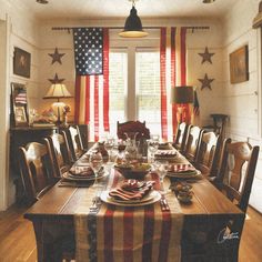 a dining room table set with american flags