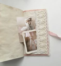 an open book with pictures and ribbons on it's cover, featuring a photo of a woman in a pink dress