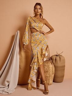 Aiyana One Shoulder Floral Maxi Dress In Yellow Elevate your autumn adventure with the Aiyana One Shoulder Floral Maxi Dress from Berrylush. This stunning dress features an iconic one-shoulder neckline that sets a bold and chic tone, making it perfect for those who desire to stand out in every crowd. Floral Elegance The playful floral print on this yellow maxi dress adds a whimsical touch of nature’s beauty. Whether you're attending an elegant evening party or exploring the city streets, this dress is designed to captivate attention and make your outfit unforgettable. Pair it with heeled pumps and a cartwheel hat for a charming look that combines boldness and grace. Material & Care Material: 95% Polyester, 5% Cotton Stretch Factor: Non-Stretch Cleaning: Gentle machine wash The dress's non- Cartwheel Hat, Outrageous Fashion, Yellow Maxi Dress, Heeled Pumps, Shapewear Tops, Yellow Maxi, Make Your Outfit, Jumpsuits And Romper, Feather Dress