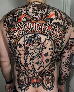 the back of a man with tattoos on his body