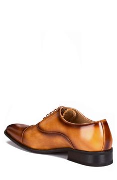 A crisp cap toe complements the polished finish of this faux-leather oxford that's sure to add professional polish to any ensemble. Synthetic upper/leather lining/rubber sole Imported Fall Oxfords With Cap Toe, Fall Cap Toe Derby Oxfords, Fall Derby Cap Toe Oxfords, Fall Cap Toe Oxfords, Fitted Oxfords For Business In Fall, Cap Toe Oxfords With Leather Footbed For Office, Fall Fitted Goodyear Welted Oxfords, Fall Business Oxfords With Goodyear Welt, Goodyear Welted Oxfords For Business In Fall