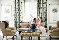 a man and woman sitting on a couch in a living room next to each other