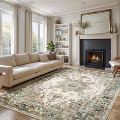 a living room filled with furniture and a fire place next to a large rug on top of a hard wood floor