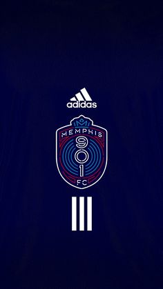 the adidas logo is shown on a dark blue shirt with white stripes and an image of a soccer ball