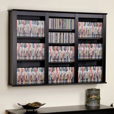 an entertainment center with many movies on the front and side shelves full of dvd's