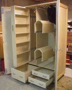 an open closet with drawers and shelves in it