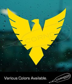 yellow bird decal on the side of a car window with rain drops around it