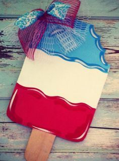 a red, white and blue ice cream on a wooden stick