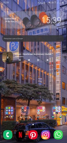 an image of a city street at night with many different icons on the phone screen