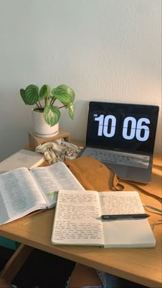 an open book sitting on top of a wooden desk