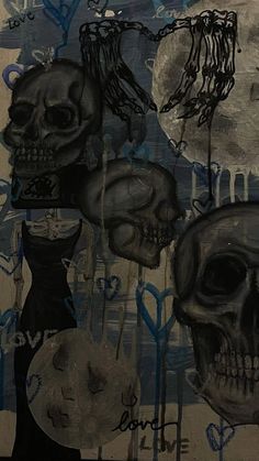 a painting with black and white skulls on it