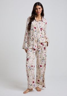 A classic, button-down pyjama shirt with piping details on cuff, collar and front patch pockets, paired with drawstring-tie, wide-leg trousers for unstructured bliss. The Evie pyjama set is cut from our butter soft satin and features an ethereal pressed floral print, exclusive to our Bramley collaboration, this set exudes feminine chic. The set comes in a printed drawstring pouch. 100% Viscose Satin  Cool machine wash only Wash inside out and with similar colours Shirt With Piping, Cotton Nightwear, Pressed Floral, Floral Pajama Set, Bias Cut Skirt, Satin Trousers, Floral Pajamas, Feminine Chic, Luxury Scarves