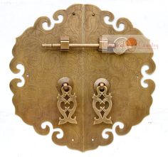 an ornately designed metal door with two handles