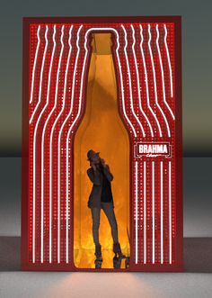 a woman standing in front of a bottle with lights on it and the words amanari above her