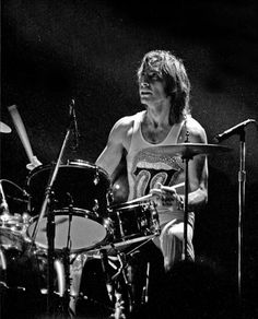 an image of a man playing drums on stage