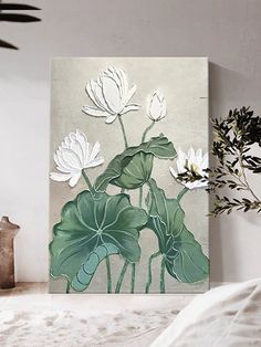 a painting with white flowers and green leaves on a wall next to a potted plant