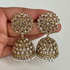 Antique Polki kundan Jhumka/stone Jhumka/Indian Jewelry/Pakistani Jewelry/Punjabi Jewelry/Statement earrings/Bridal earring/Indian wedding Length 2.25 inches Width 1 inche This is 100% Handmade jewelry. So Color, shades, texture displayed may slightly vary from the actual product due to digital image limitations. We request you to consider these minor variations. Please expect the possibility of some slight imperfections when buying hand made jewelry. If you have any questions, please message or Luxury Kundan Jhumkas For Eid, Luxury White Jhumkas With Latkans, Luxury Kundan Round Jhumkas, Luxury Kundan Jhumkas With Gota Work, Luxury Festive Stone Work Jhumkas, Luxury Kundan Temple Jewelry Jhumkas, Indian Bridesmaids Earrings, Luxury Hand Set Jhumkas For Wedding, Festive Kundan Bridal Earrings With Stone Work