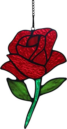 a stained glass rose hanging from a chain