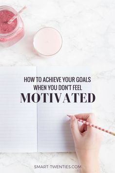 someone writing on a notebook with the words how to achieve your goals when you don't feel motivitated