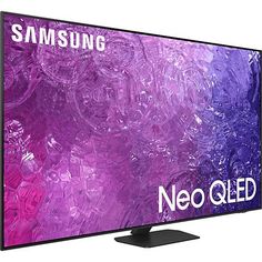 the samsung qled tv is shown in front of a white background with purple swirls