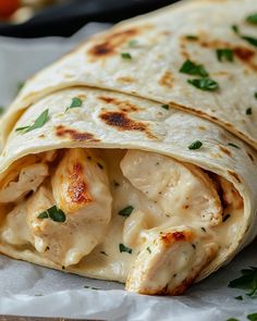 a tortilla filled with chicken and cheese