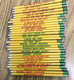 several yellow pencils with writing on them