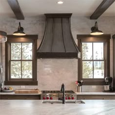 a kitchen with two windows and a stove top oven in it's center island