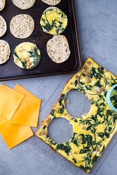 some food is laying out on a baking tray and next to it are crackers