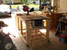 a small table sitting in the middle of a garage