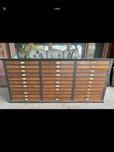 a large wooden cabinet sitting on top of a carpeted floor