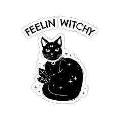 a black cat with the words feelin witchy on it's back and stars around