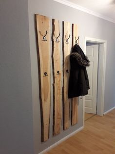 a coat rack with skis hanging on it