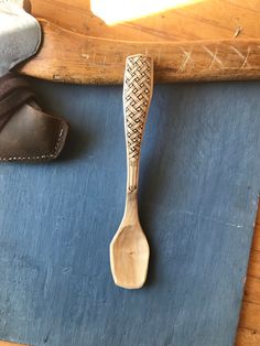 a wooden spoon sitting on top of a blue mat