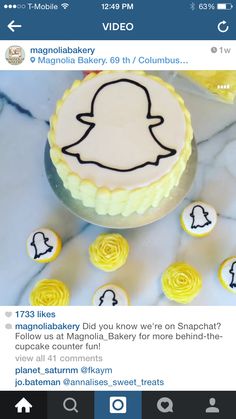 the cake is decorated with yellow icing and has a snapchat on it