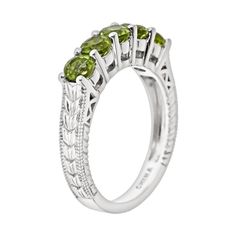 Add timeless charm to any outfit with this spectacular peridot ring. Click on this JEWELRY & WATCHES GUIDE to learn about fit, styles, materials and more!Ring Details: Width: .16-in. Metal: rhodium-plated sterling silver Features: chevron-textured band & milgrain details Gemstone Details: Gemstone type: genuine peridot Cut: round Setting: prong  Size: 10. Color: Green. Gender: female. Age Group: adult. Peridot Stone, Right Hand Rings, Citrine Stone, Citrine Ring, Peridot Ring, Ring Silver, Sterling Ring, Stone Rings, Rhodium Plated