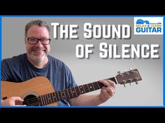 a man holding an acoustic guitar with the words, the sound of silence on it