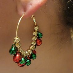 'Tis the season for jingly-jangly joy! Deck out your lobes with these Christmas Jingle Hoop Earrings. A pair of 2x2" merry-n-bright gold hoops adorned with green and red Christmas bells. A festive addition sure to make the season shine. Jingle Bell Earrings Diy, Green Dangle Christmas Jewelry, Festive New Year Dangle Jewelry, Christmas Holiday Green Jewelry, Holiday Festive Nickel-free Jewelry, Green Christmas Holiday Jewelry, Nickel-free Jewelry For Festive Holidays, Nickel-free Jewelry For Festive Holiday, Green Dangle Hoop Earrings For Celebration