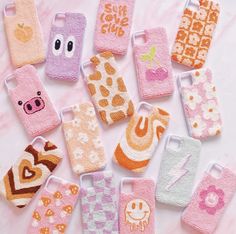 there are many different cell phones made out of knitted material and decorated with animal faces